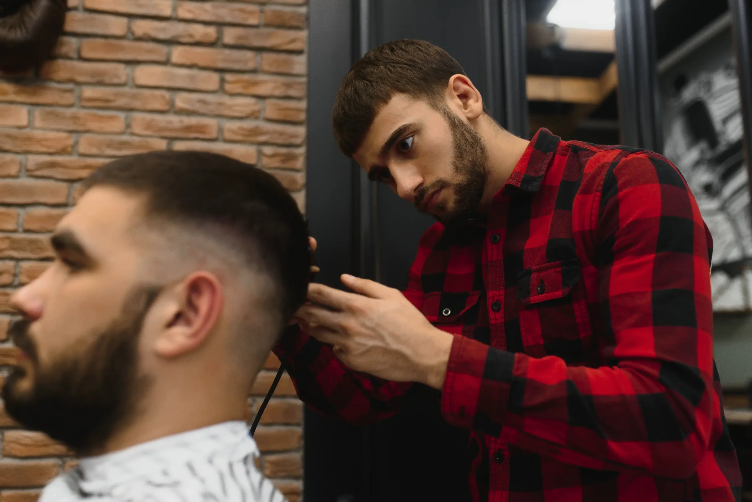 Buzz cut by a professional barber.